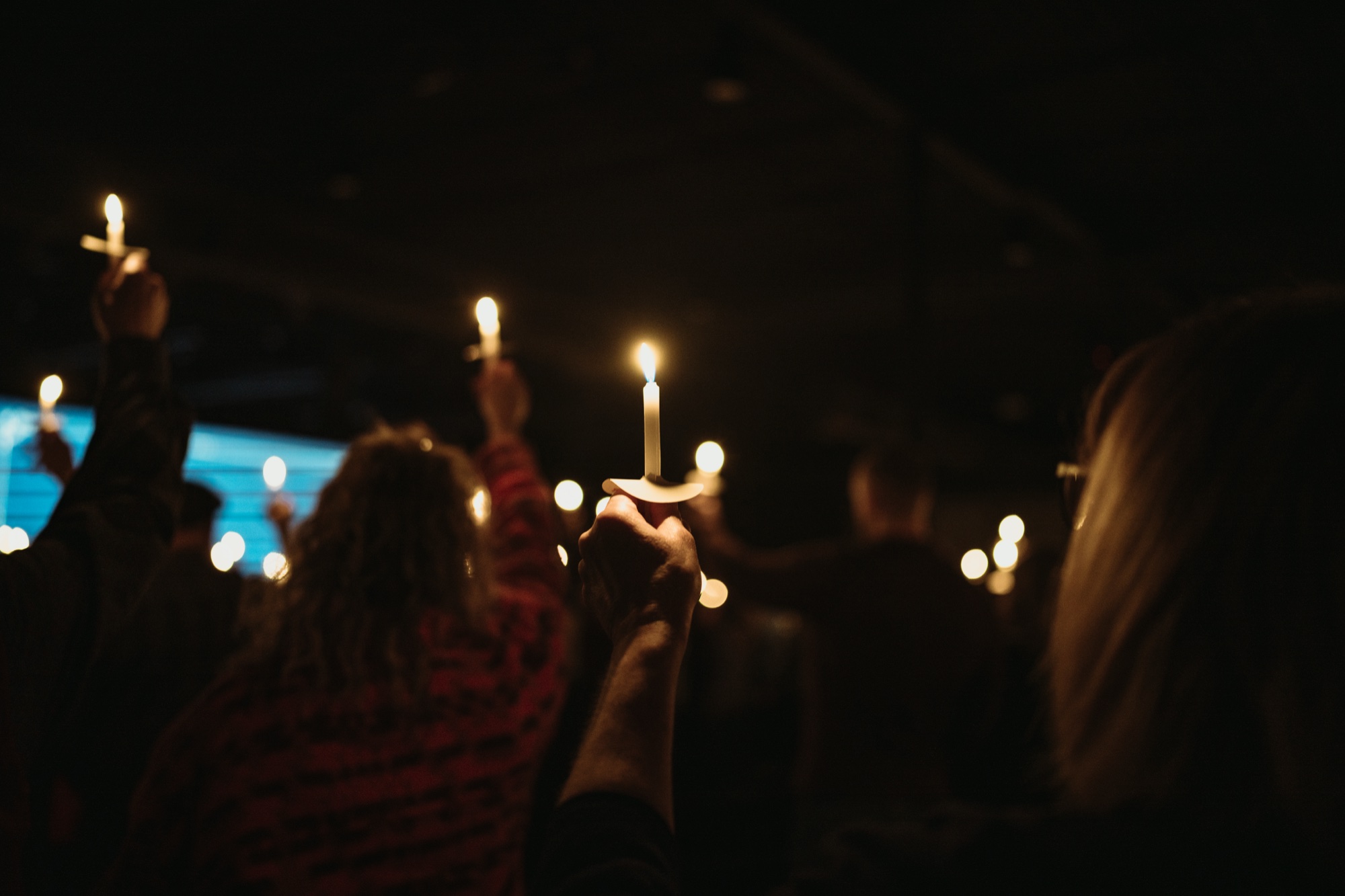 Christmas worship gathering with candlelight